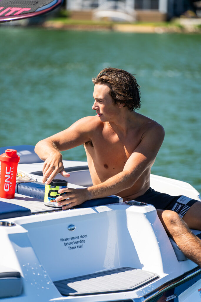 GNC model with product from the summer flavors campaign